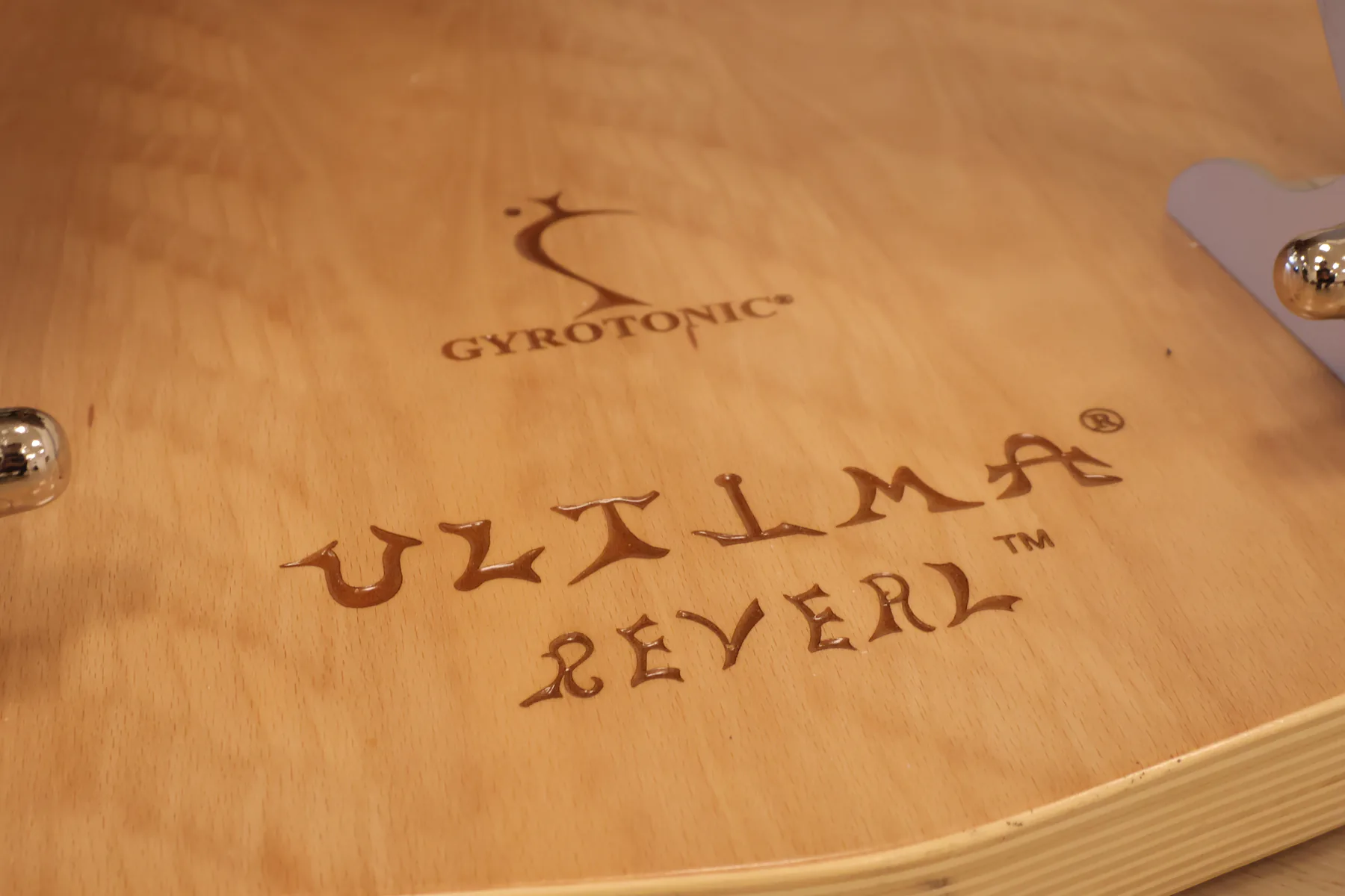 GYROTONIC® logo detail on the wooden apparatus base.